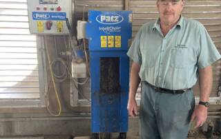 Patz customer - Stephen McKnight - standing by Patz IntelliChain in barn